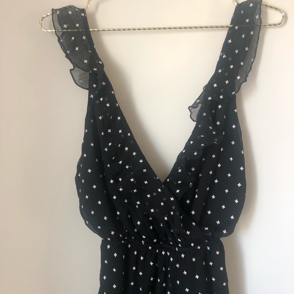 Revolve by the way. Aurora Ruffle Romper in Black - Picture 4 of 7